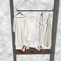 Minimalist White Clothes Hanging On Rack With High Heels And Handbag