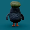 Knitted Puffin Doll With Green Hat Orange Beak Blue And White Body On Blue Background