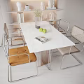 Modern Dining Table Set With Marble Top Metal Frame Rattan Chairs Vase Green Apples Book