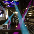 Modern KTV Interior With Purple Blue Lighting Leather Sofa And Big Screen