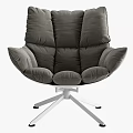 Gray Leisure Chair With Plush Cushions And White Star Shaped Metal Base