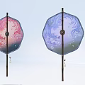 Two Pink And Blue Octagonal Hanging Decorations With Floral Patterns And Tassels