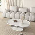 Modern White Oval Coffee Table With Books Vase And Tray On Beige Carpet