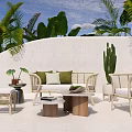 Elegant Outdoor Wicker Sofa With Green Cushions Side Tables And Palm Trees In Tropical Garden