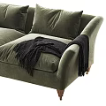 Green Velvet Two Seater Sofa with Dark Pillows and Black Throw Blanket and Wooden Legs