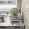 Dinnerware Set in White Rack with Green White Plates Glass Cups on Marble Kitchen Countertop