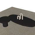 Modern Black Oval Coffee Table With Round Side Table And White Decorative Pieces