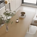 Modern Living Dining Room Interior With Curved Sofa Round Coffee Table Wave Rug And Soft Lighting