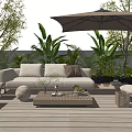 Comfortable Beige Outdoor Sofa on Wooden Deck With Large Umbrella Coffee Table And Green Plants