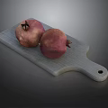 Gray Wooden Cutting Board With Two Fresh Ripe Pomegranates On Top