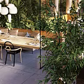 Open Restaurant Interior With Lush Greenery Natural Light Cozy Seating And Wooden Dining Tables