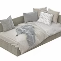 Cozy Two seater Sofa with Patterned Pillows and Soft Blanket in Neutral Tones