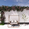 Cozy Hanging Swing Chair with Cushions Under Pink Flowering Vines on White Wall and Sapling