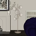 Modern Glass Ball Floor Lamp With Gold Stand Near Blue Sofa And Wall Art