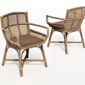 Two Rattan Leisure Chairs With Armrests And Striped Seat Cushions