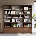 Modern Wooden Bookshelf With Multiple Shelves Drawers Books Decorative Items And Potted Plants