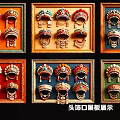 Various Styles of Decorative Traditional Headwear Pendants on Framed Display Boards