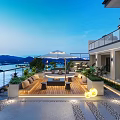 Modern Garden Landscape With Outdoor Terrace Wooden Deck Sofa Umbrella Water View And Mountain Backdrop