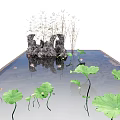 Small Garden Ornament With Lotus Leaves Flowers And Rock Formations In Pond