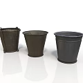 Three Black Metal Utility Buckets With Various Designs And Classic Shapes For Storage