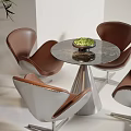 Modern Table Chair Set With White Brown Leather Seats Glass Top And Metal Base Green Plant