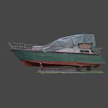Green and Red Hull Yacht Covered with Tarpaulin on Stands in Grass Area