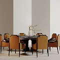 Dining Table Set with Orange Chairs Dark Frames and Vase with Branches in Light Background