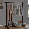 Organized Closet With Hanging Clothes In Soft Colors And Storage Boxes