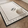 Square Beige Rug With Black Border On Geometric Wooden Floor Featuring Magazine And Decorative Stone