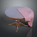 Round Wooden Dining Table With Partially Covered Red And White Checkered Tablecloth 3d model