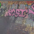 Colorful Graffiti Art On Textured Vintage Wall With Green And Pink Patterns