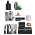 Dark Bookcase With Books Decorative Vases Jars Spheres And Storage Boxes On Shelves