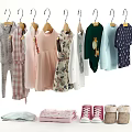 Kids Clothes Hanging On Hangers With Various Styles Colorful Outfits And Folded Clothes