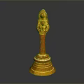 Golden Decorative Sculpture Featuring Intricate Carving And Ornate Base Design