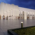 Modern White Hotel Building With Arch Design And Open Plaza Night Lighting