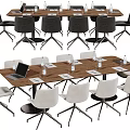 Modern Office Conference Table With Laptop Water Bottles And Comfortable Chairs