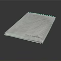 Light Colored Spiral Bound Notebook With Grid Lines And Evernote Logo On Dark Background