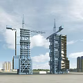Industrial Factory Building Under Construction With Tower Cranes And Blue Steel Structure