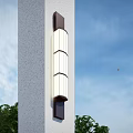 Modern Outdoor Wall Light With Cylindrical Shades On White Pillar Against Green Trees Blue Sky