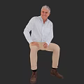 White Haired Man Wearing White Shirt Beige Pants And Brown Shoes Sitting Against Black Background