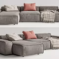 Modern Gray Fabric Sectional Sofa With Pink And Beige Pillows And Plaid Blanket