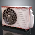 Old Rusted Air Conditioner Outdoor Unit With Metal Fan Grille And Heat Sink