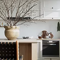 Restaurant Kitchen Interior with White Cabinets Chandelier Vase and Coffee Machine