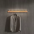 Wall Mounted Wooden Coat Hooks With Gray Suit Jacket On Textured Gray Wall