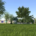 Tranquil Rural Landscape With Lush Green Grass Tall Trees And Light Building With Blue Windows