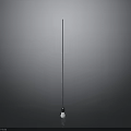 Person Standing Under Tall Vertical Pole Against Gray Background