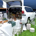 HUAWEI Photo Check In Spot With White SUV Open Trunk Balloons Table Chairs And Flags