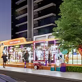 Vibrant Nighttime Commercial Street With Well Lit Shops Pedestrians Cars And Trees