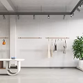 Minimalist Clothing Store Interior with Hanging Clothes Arched Mirror and Shelved Cabinets