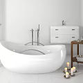 White Freestanding Bathtub in Modern Bathroom Interior with White Vanity Wooden Side Table and Candles